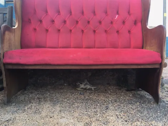 lonely shoe under a red velvet bench | Lonely shoes